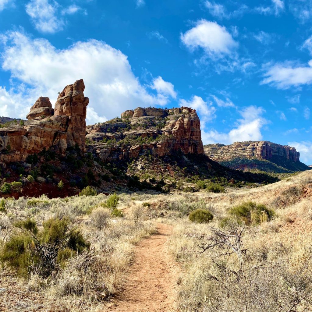 Hiking Colorado National Monument No Thoroughfare with wall view